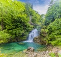 A long exposure view of the falls and splash pool on the Radovna River at the end of the Vintgar Gorge in Slovenia