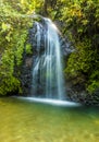 A long exposure view the Gendarme waterfall cascading into the plunge pool in the rain forest of Martinique Royalty Free Stock Photo