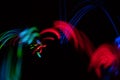 Long exposure view of glow-in-the-dark dice in motion with bokeh light trail Royalty Free Stock Photo