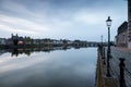 Long exposure view of the historic skyline of Maastricht with a view over the river Meuse and the old roman bridge Royalty Free Stock Photo