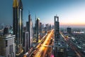 Long exposure view of traffic and skyline from rooftop at sunset Dubai - UAE Royalty Free Stock Photo