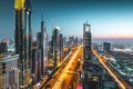 Long exposure view of traffic and skyline from rooftop at sunset Dubai - UAE Royalty Free Stock Photo