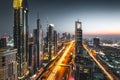 Long exposure view of traffic and skyline from rooftop at sunset Dubai - UAE Royalty Free Stock Photo