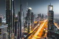 Long exposure view of traffic and skyline from rooftop at sunset Dubai - UAE Royalty Free Stock Photo