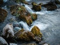 Long exposure waterfall over rocks in forest landscape Royalty Free Stock Photo