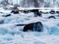 Long exposure waterfall over rocks in forest landscape Royalty Free Stock Photo