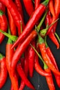 Long fed pepper, on black stone background, top view flat lay Royalty Free Stock Photo