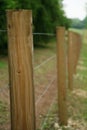 Long fence of wooden posts 2