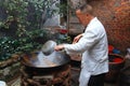 Long Feng, China: Chef Cooking at Wok Royalty Free Stock Photo