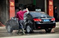 Long Feng, China: Man Washing Car