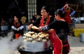 Long Feng, China: Women Preparing Food