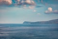 Long focus photography. Small fishing boat on the surface of Atlantic ocean. Royalty Free Stock Photo