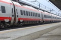 Long Frecciarossa train at a station in Venice, Italy