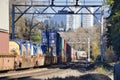 Long freight train loaded with cargo containers. November 8th 2020 Burnaby BC