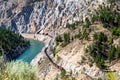 Long freight train snakes along the precipitous Thompson Canyon Royalty Free Stock Photo