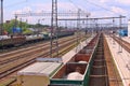 Long freight trains are on railways near station