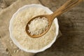 Long grain rice in a wooden spoon on a background plate. Healthy eating, diet Royalty Free Stock Photo