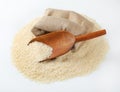 Long grained rice, wooden scoop and burlap bag