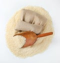 Long grained rice, wooden scoop and burlap bag