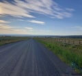 Long gravel road at sunrise