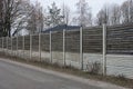 Long gray white wall of wooden private fence wall