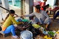 Long Hai, Vietnam - Dec 29, 2014: Vietnamese fast food Banh Xeo and Banh Can vendors at Long Hai fish market on early morning, L