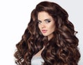 Long hair. Beautiful brunette woman portrait with curly shiny ha Royalty Free Stock Photo