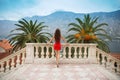 Long hair. Beautiful young brunette girl model in red dress stan Royalty Free Stock Photo