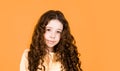 Long hair. Easy hairdo. Beauty supplies. Perfectly untangle curly hair. Pretty girl curly hair yellow background