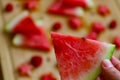 Watermelon macro shot, lots of watermelon at background.