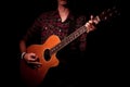 Long hair guy playing guitar acoustic Royalty Free Stock Photo