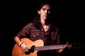 Long hair guy playing guitar acoustic Royalty Free Stock Photo