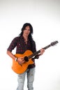 Long hair guy playing guitar acoustic Royalty Free Stock Photo