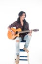 Long hair guy playing guitar acoustic Royalty Free Stock Photo