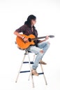 Long hair guy playing guitar acoustic Royalty Free Stock Photo