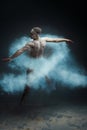 Long hair muscle man dancer in dust. Prostate cancer concept Royalty Free Stock Photo