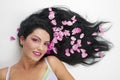 Long hair with pink rose petals Royalty Free Stock Photo