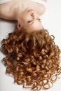 Long hair. Waves Curls updo hairstyle in salon. Fashion model, w Royalty Free Stock Photo