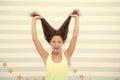 Long hair will always be on trend. Happy girl hold long hair. Trendy long hairstyle. Long hair growth stimulant. Natural