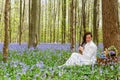 Long hair woman in bluebells forest Royalty Free Stock Photo