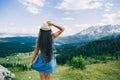 Long hair woman travel in mountains landscape back view Royalty Free Stock Photo