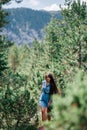 Long hair woman travel in spruce forest Royalty Free Stock Photo