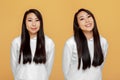 Long-haired asian woman with shiny hair, female client satisfied by result of professional beauty haircare products use Royalty Free Stock Photo