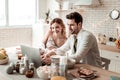 Long-haired beaming pretty woman in home clothes looking happy Royalty Free Stock Photo