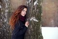 Long-haired brunette girl in a winter jacket