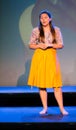 long-haired brunette woman in various positions and barefoot expressions with long skirt Royalty Free Stock Photo