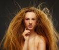 Long-haired curly redhead woman Royalty Free Stock Photo