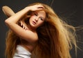 Long-haired curly redhead woman Royalty Free Stock Photo