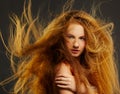 Long-haired curly redhead woman