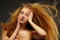 Long-haired curly redhead woman Royalty Free Stock Photo